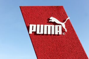 Two More Elite Runners Sue Puma Over Allegedly Defective Carbon Racers Skanderborg, Denmark - May 5, 2016: Puma logo on a wall. Puma is a major german multinational company that produces athletic and casual footwear, as well as sportswear
